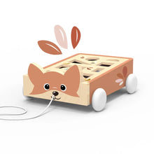Load image into Gallery viewer, Wooden toy dog with wheels and a string on a white background