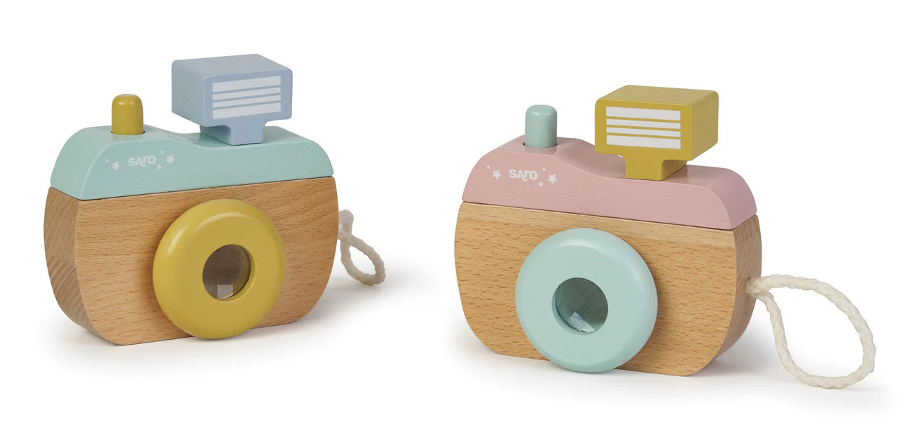 Two wooden toy cameras with pastel colors on a white background