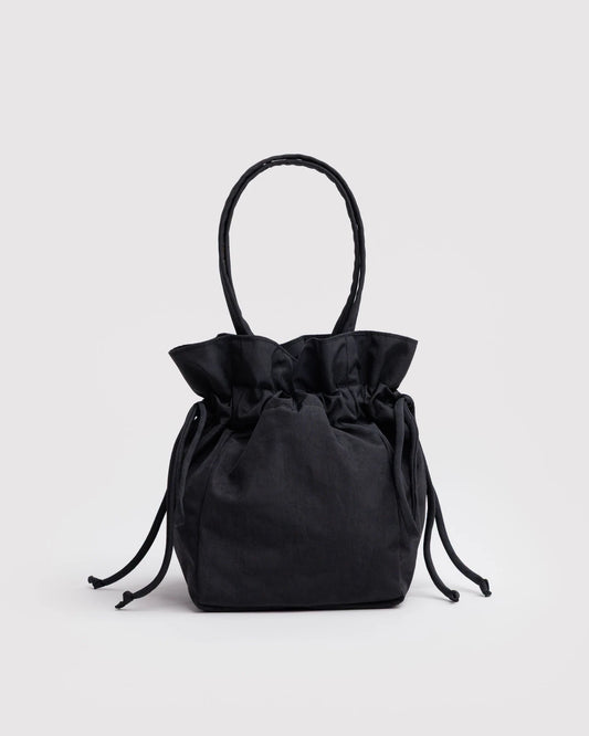 Black drawstring bag on a light gray background