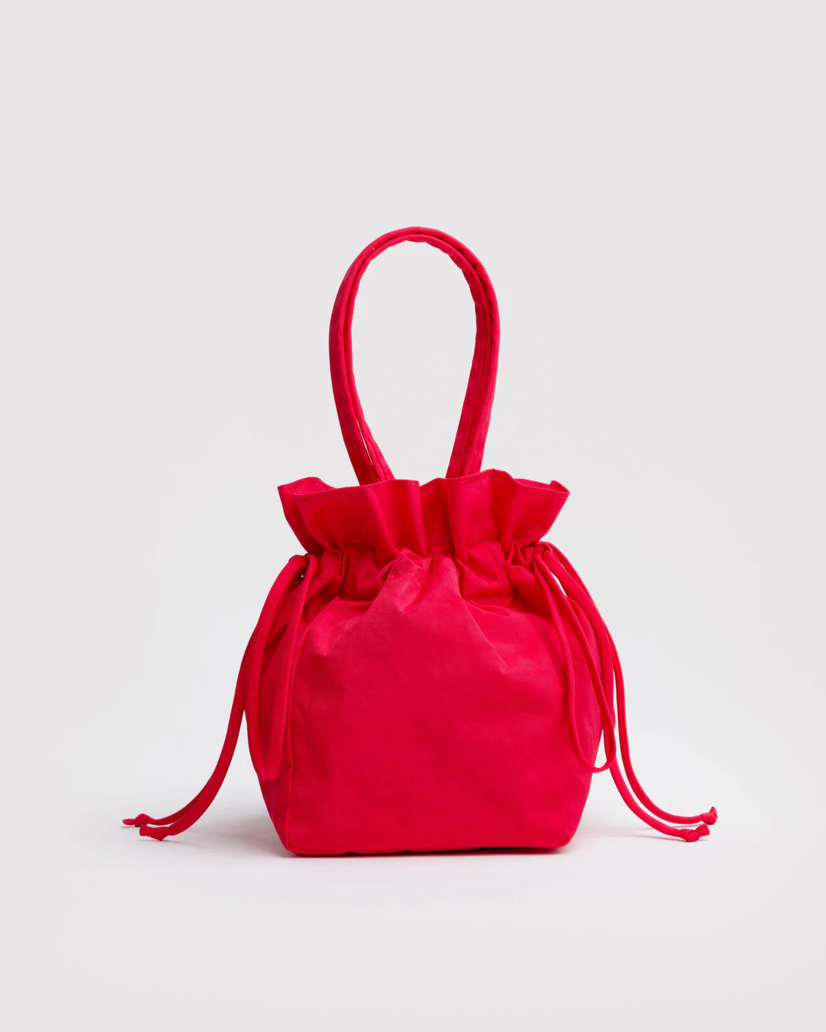 Red drawstring bag on a light gray background
