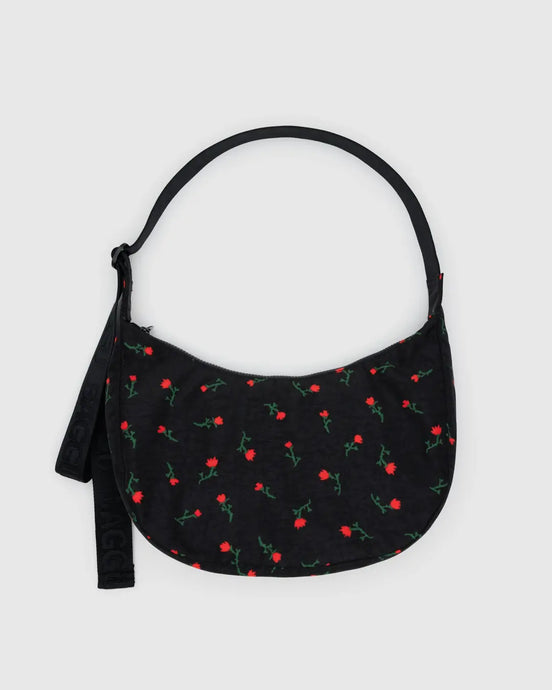 Baggu black handbag with red floral pattern on a light gray background