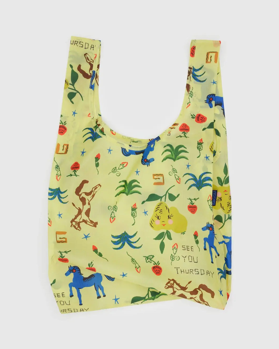 Baggu reusable bag with colorful animal and plant western pattern on a light green background